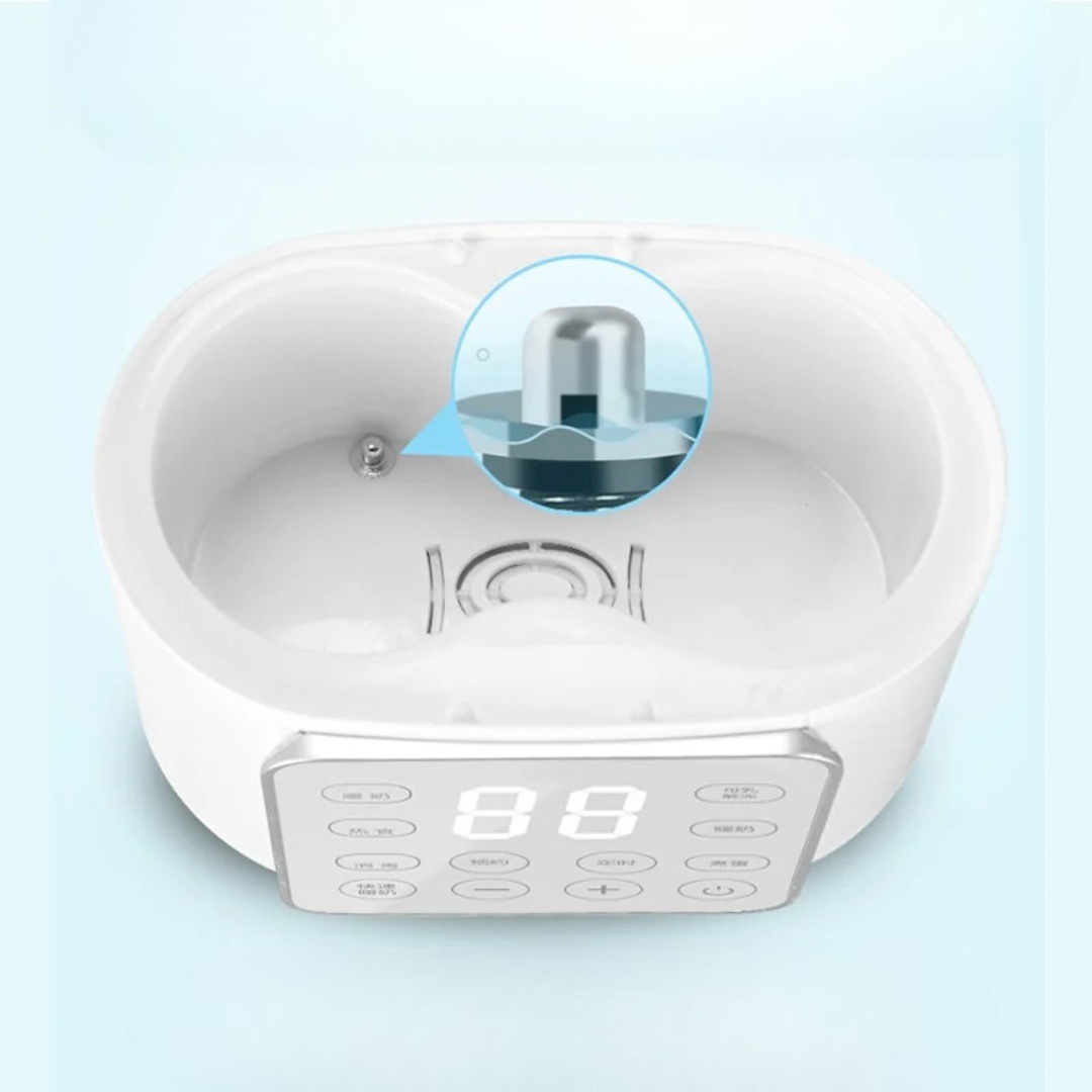 Chauffe-biberon multifonction blanc avec panneau de contrôle digital.