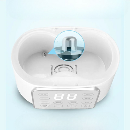 Chauffe-biberon multifonction blanc avec panneau de contrôle digital.